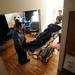 Huron Valley Ambulance employees wheel 19-year-old Lukequan Williams through the front door and into his make-shift bedroom in Romulus. Williams, a quadriplegic, was returning home from a lengthly stay at University of Michigan Hospital where he was treated after being shot. Melanie Maxwell I AnnArbor.com